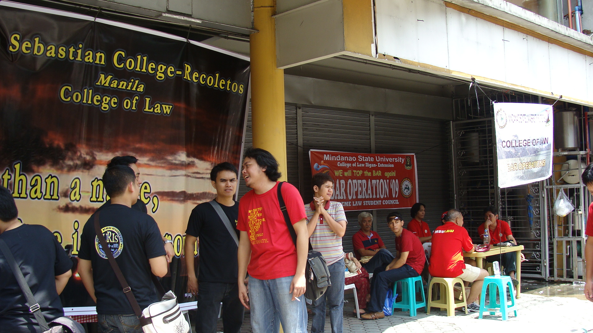 San Sebastian's bar ops is one of the few who managed to make camp at Taft Avenue, under a building's shade